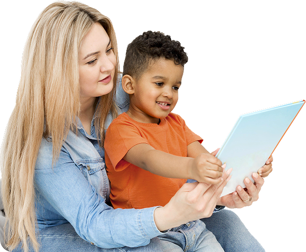 Young Boy Looking Notebook While Being Held By Woman